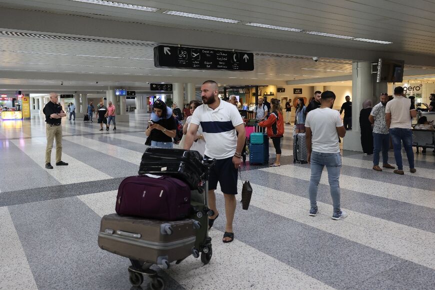 Passengers at Beirut airport where some flights have been cancelled