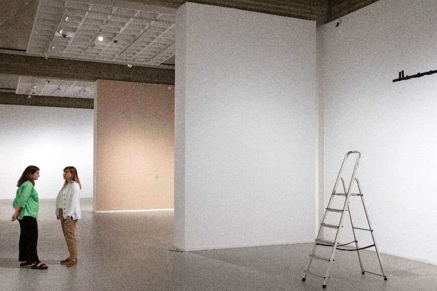 Some galleries are now vacant, with blank walls decorated only with empty hooks and printed descriptions for the art that once hung there