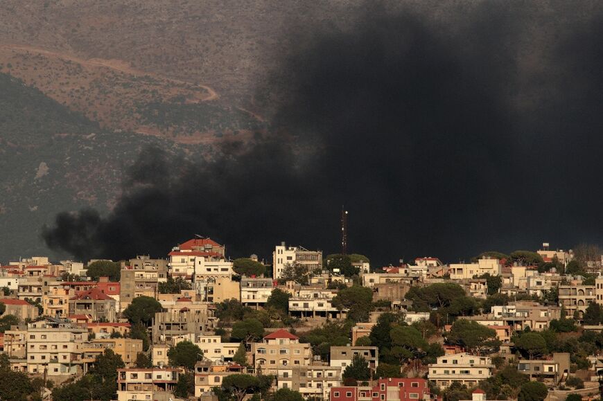 Smoke billows during Israeli bombing of Khiam, southern Lebanon, which is not far from a base of UN Spanish peacekeepers