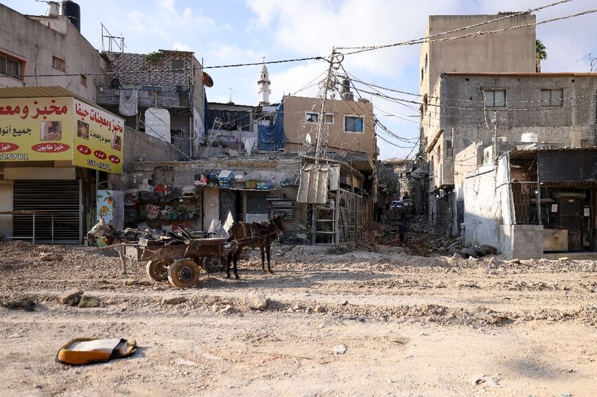 The Israeli military initially sent bulldozers to tear up tarmac streets, sending clouds of dust over the targeted areas