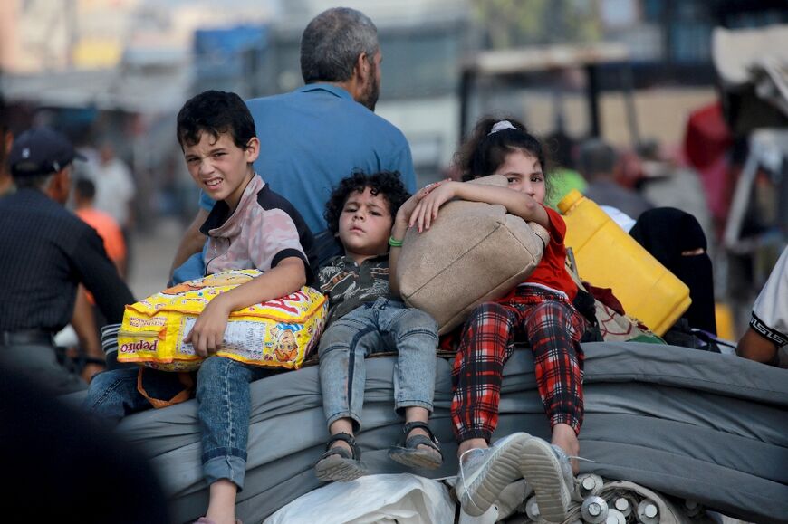 A Palestinian family flees Gaza's main southern city of Khan Yunis in response to an Israeli evacuation order. With fewer and fewer places to go, many Gazans say no longer heed the orders