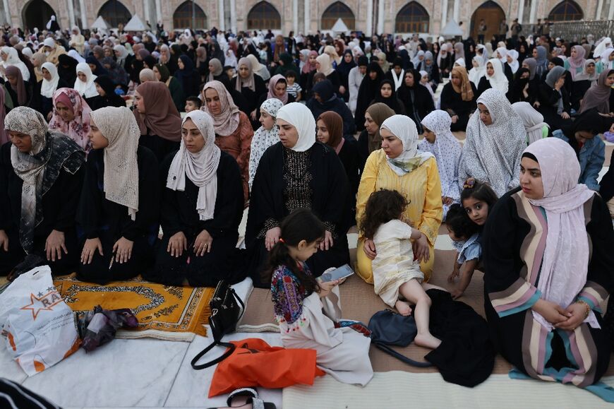 Women pray at a Sunni Muslim mosque in Baghdad on the first day of the Eid al-Fitr celebration on April 10, 2024