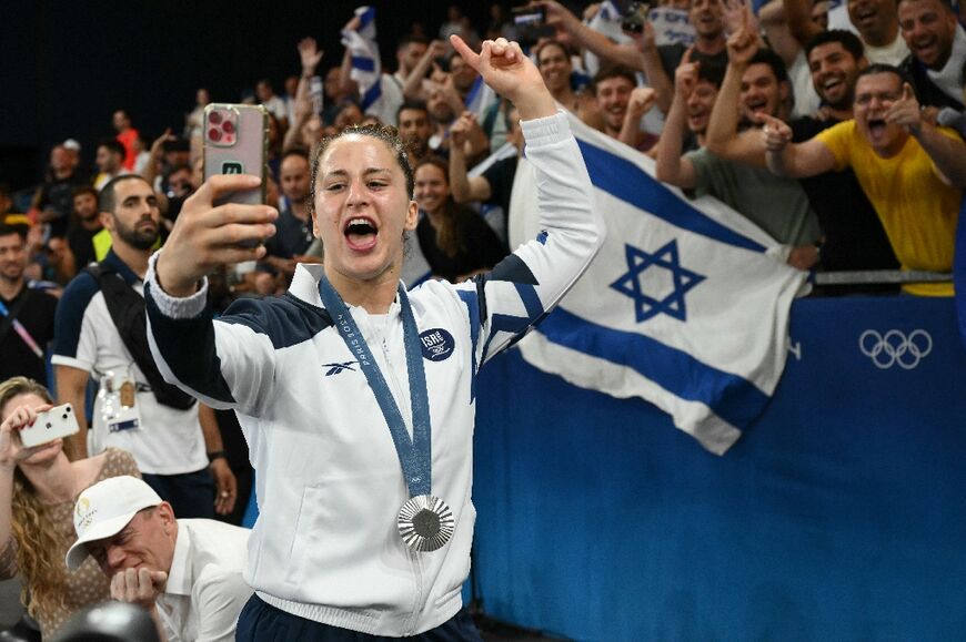 Silver medallist Inbar Lanir celebrates with the crowd