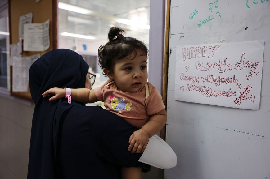 The triplets' mother says she was forced to return to Gaza without her newborns because her Israeli travel permit had expired and they needed the specialist neonatal care only the Al-Maqased Hospital could provide