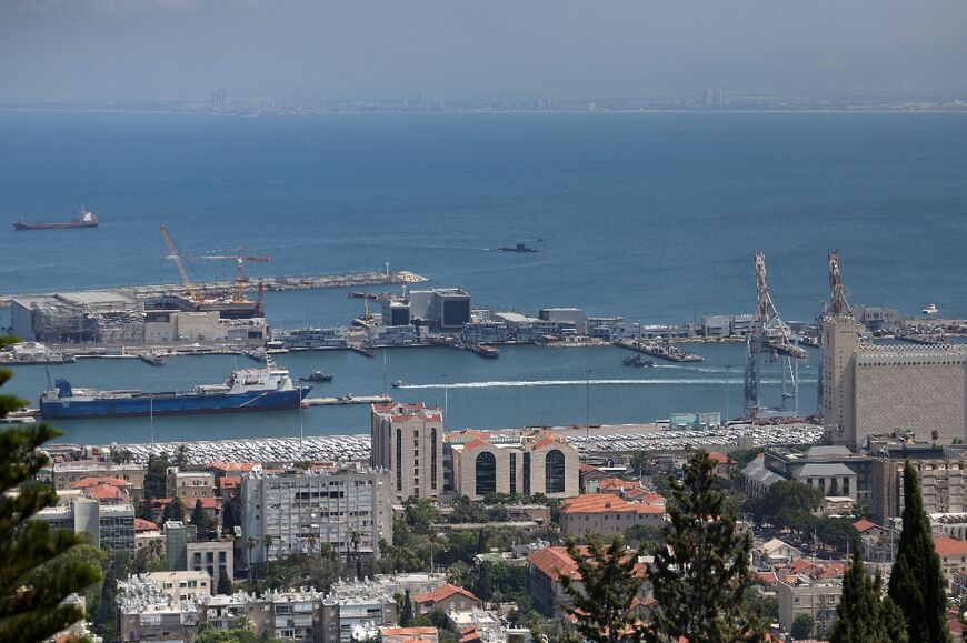 A military submarine surfaces off the Israeli port city of Haifa, as diplomats try to reach a Gaza truce deal that could avert regional war 