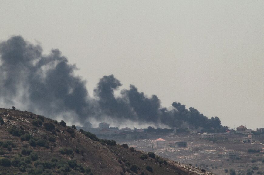 Smoke billows from the site of an Israeli strike on the southern Lebanese village of Taybeh amid growing fears of an all-out war between the two countries following the assassinations, blamed on Israel, of two top Hamas and Hezbollah figures