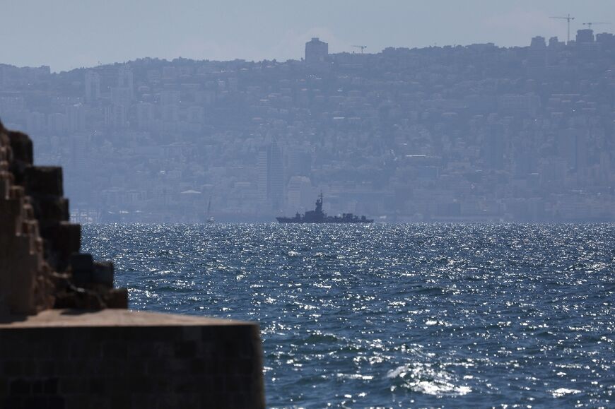 A military frigate patrols near the northern Israeli coastal city of Acre 