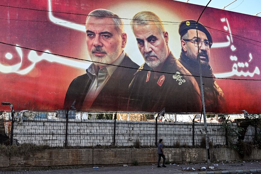 A Beirut billboard that says, "We are avenging," carries pictures of (L to R) Hamas political leader Ismail Haniyeh, Iran's Islamic Revolutionary Guard Corps' Quds Force commander Qasem Soleimani, and Hezbollah commander Fuad Shukr -- all slain