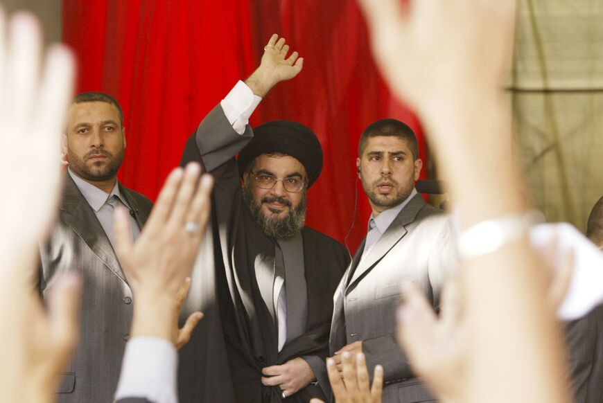 BEIRUT, LEBANON- SEPTEMBER 22: Hezbollah leader Sayyed Hassan Nasrallah waves during his speech at a rally September 22, 2006 in Beirut, Lebanon. According to reports, Nasrallah said that Hezbollah guerrillas would not disarm until a Lebanese government capable of protecting the country was in place. (Photo by Salah Malkawi/Getty Images)