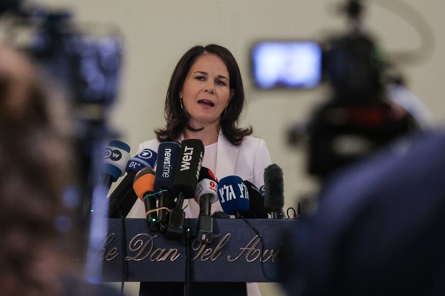 German Foreign Minister Annalena Baerbock speaks to reporters in Tel Aviv after meeting her Israeli counterpart