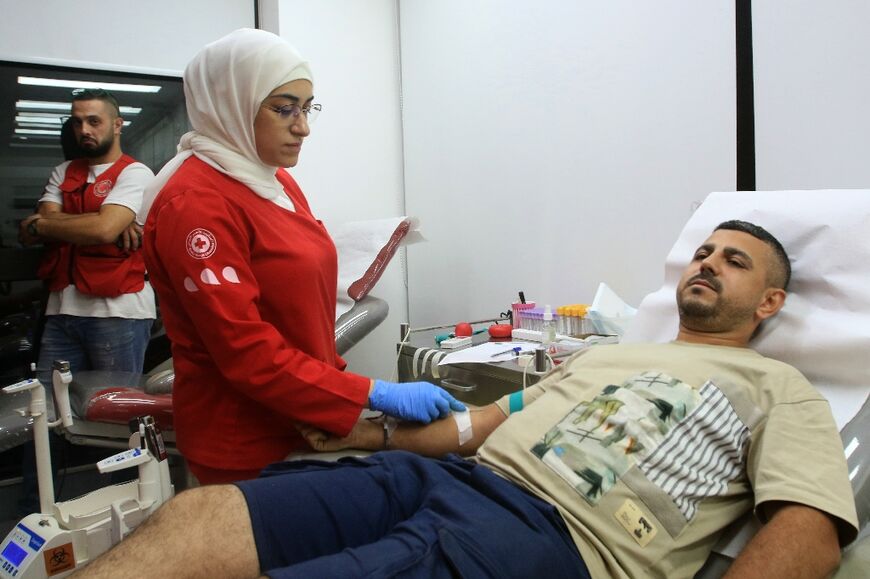 A man donates blood in the southern Lebanese city of Sidon following the pager blasts