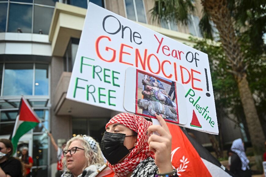 Pro-Palestinian protesters hold signs at a rally in support of Gaza and Lebanon in Orlando, Florida