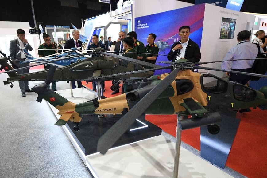 Models of attack helicopters made by Turkish Aerospace Industries (TAI) on display at a defence exhibition in Manila last month 