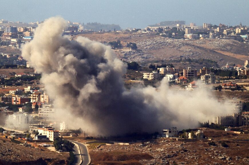 Smoke rises over the south Lebanon village of Kfar Rumman following an Israeli air strike