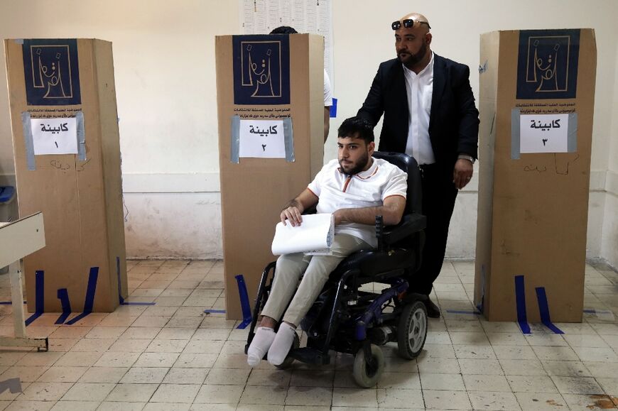 A voter at a polling station in Arbil, the capital of Iraq's autonomous kurdistan, casts his ballot in the parliamentary election