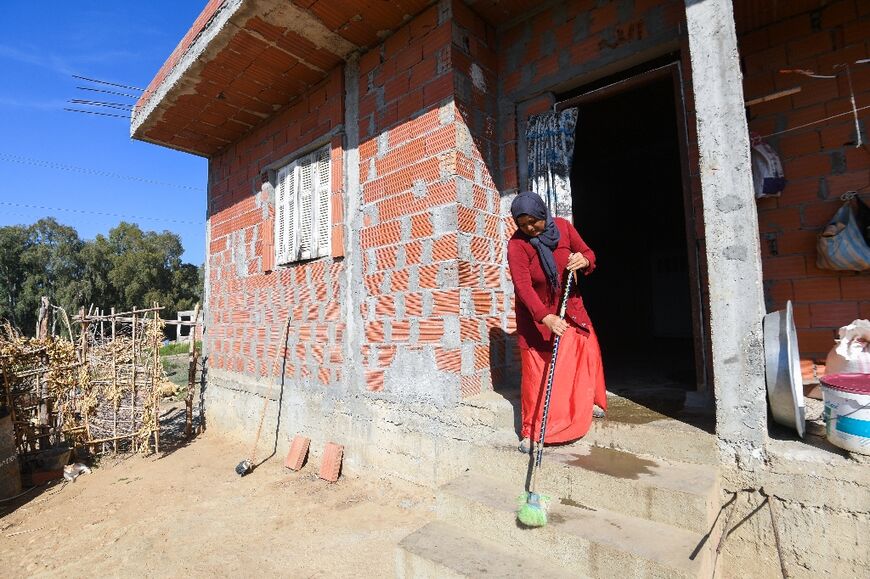 Chedliya Mzrighi, lives in a home with no electricity or toilet, while her husband has left to find work