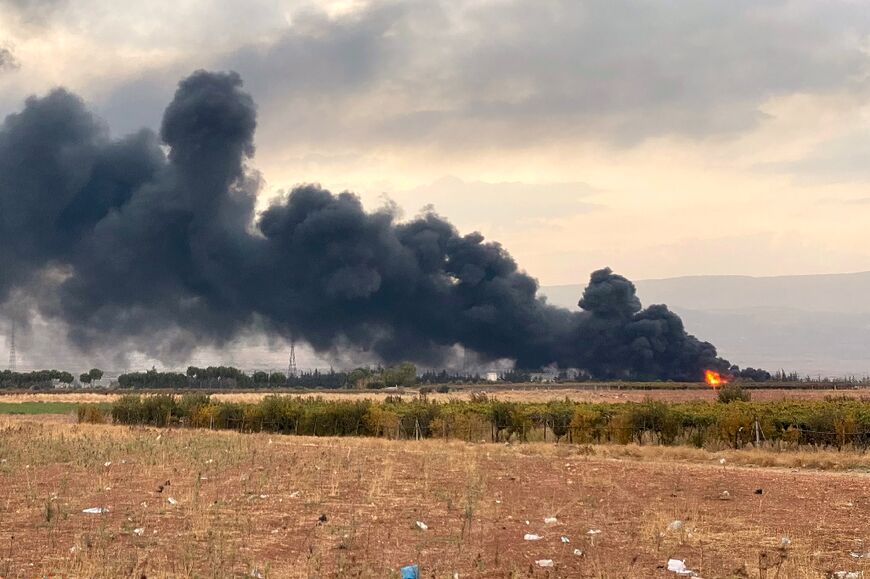 The aftermath of an Israeli air strike that targeted oil reservoirs in Lebanon's eastern town of Douris in the Bekaa Valley