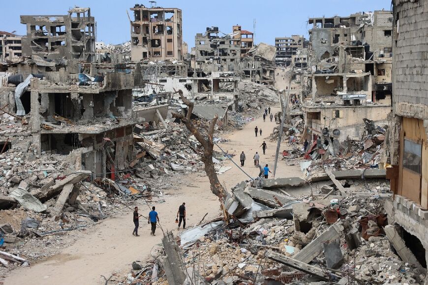 Palestinians in devastated Gaza City on October 7, 2024, the first anniversary of the ongoing war between Israel and the Palestinian Hamas group