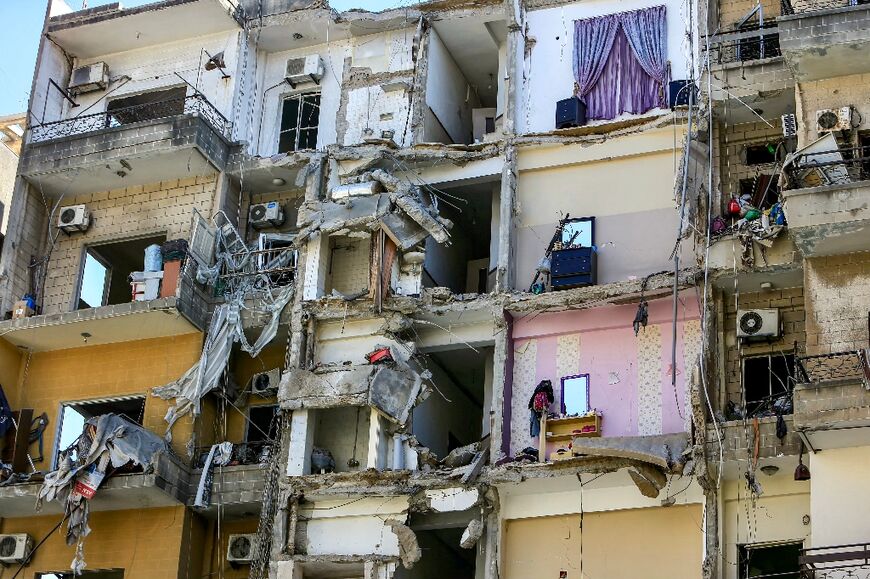 Rooms are exposed after a portion of a building collapsed following an Israeli air strike in Lebanon's southern city of Tyre 