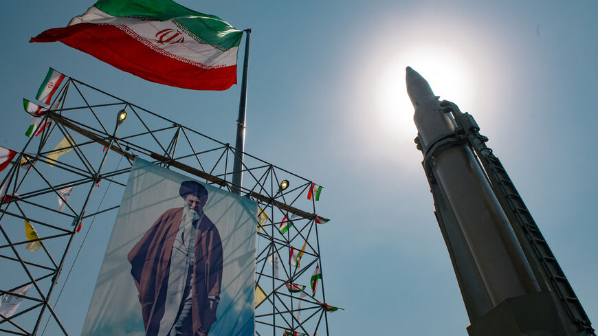 A big banner depicting Iran's Supreme Leader Ayatollah Ali Khamenei is placed next to a ballistic missile in Baharestan Square, on the sideline of an exhibition that marks the 44th anniversary of the start of the Iran-Iraq War, Tehran, Iran, Sept. 26, 2024. 