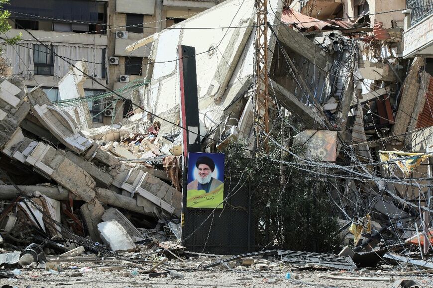 A portrait of slain Hezbollah leader Hassan Nasrallah amid the rubble in Beirut's southern suburbs