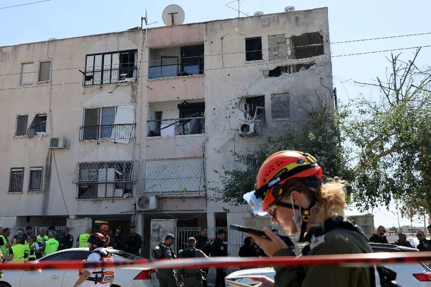 A rocket damaged a three-storey building and destroyed cars in Kiryat Ata, AFP footage showed