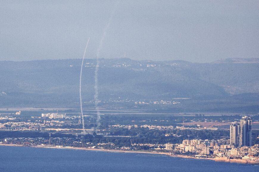 Israeli air defences intercept rockets fired from Lebanon, near Acre in northern Israel 