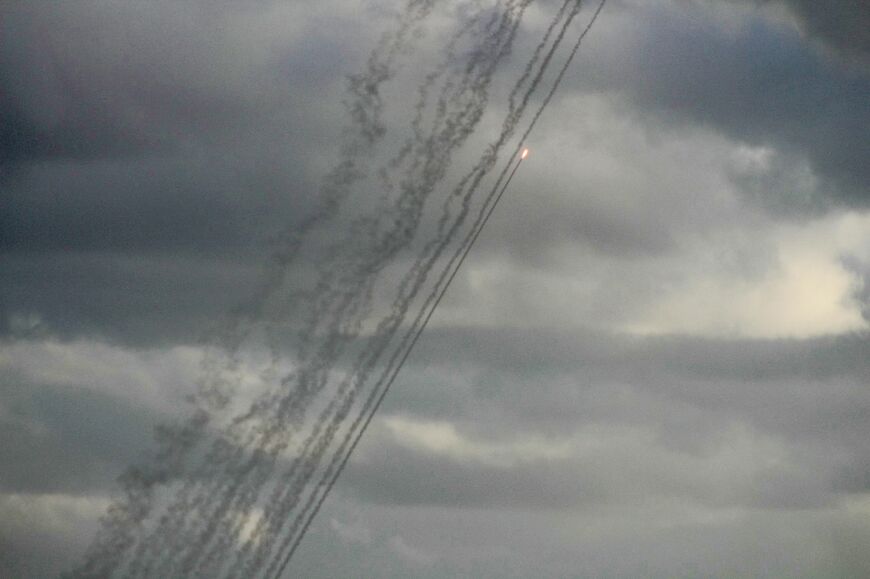 Seen from the southern Lebanese city of Tyre, rockets are fired from Lebanon towards Israel