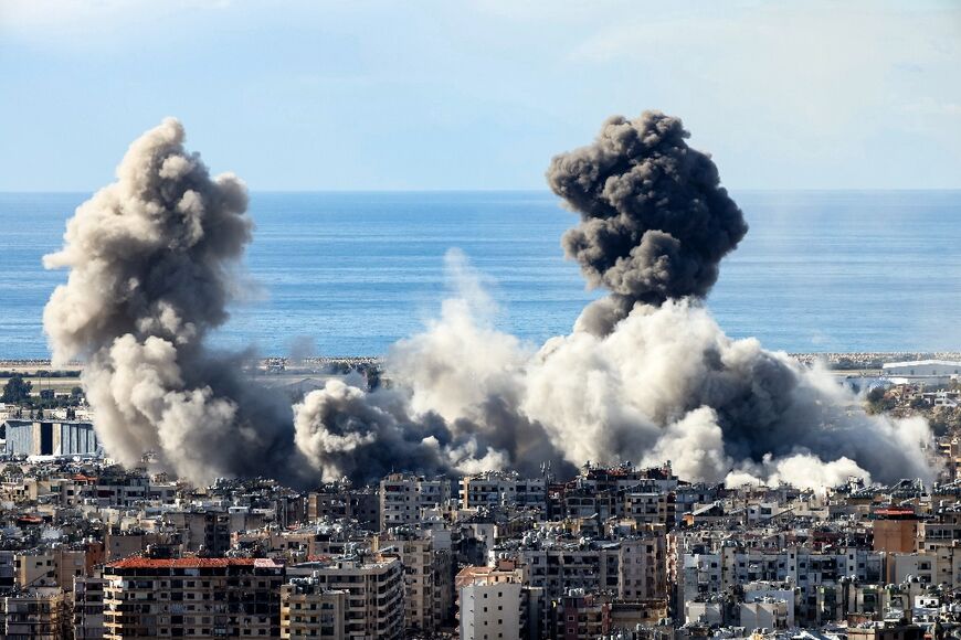 Smoke rises from the site of an Israeli airstrike that targeted Beirut’s southern suburbs before the ceasefire took effect