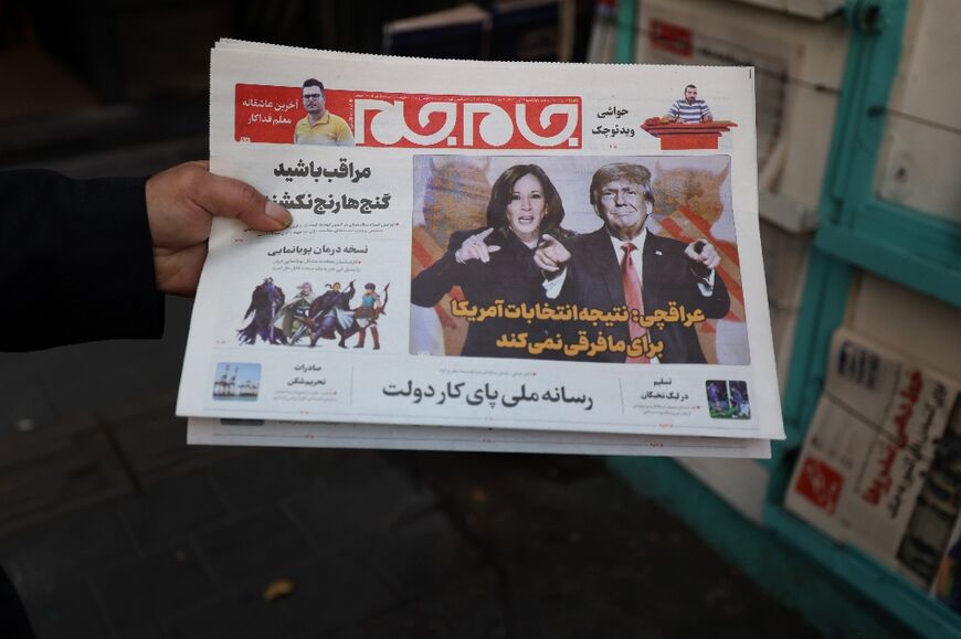 An Iran daily put a composite picture of the two US candidates on its front page, with demons depicted looming behind them