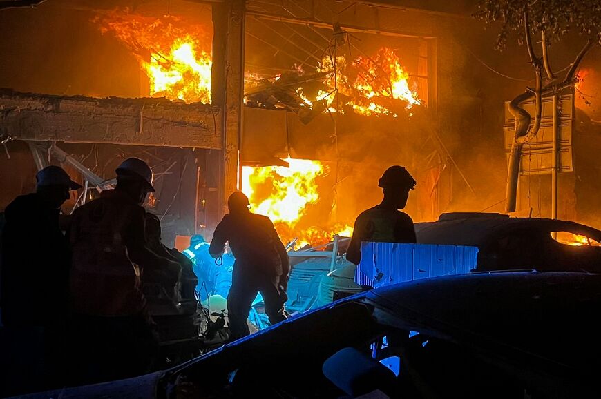 Lebanese emergency services battle a fire at the site of a deadly Israeli strike that targeted a building in Mar Elias Street, central Beirut