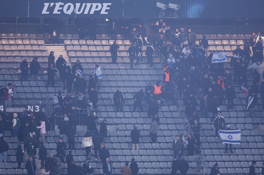 Stadium security staff intervene to stop Israel and France supporters from clashing at the Stade de France