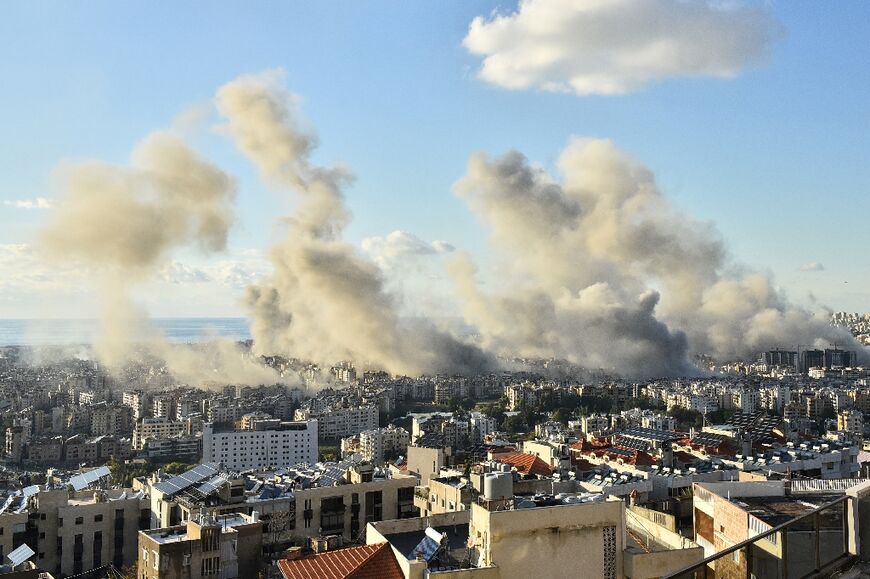 Smoke billows above Beirut's southern suburbs during a spate of Israeli air strikes on Tuesday