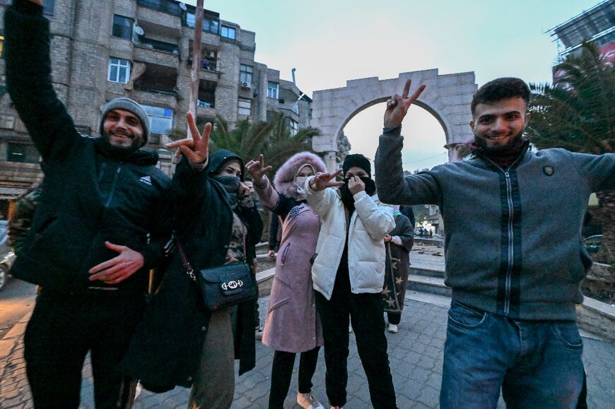 Damascus residents take to the streets in celebration after rebels say they have toppled Assad's rule