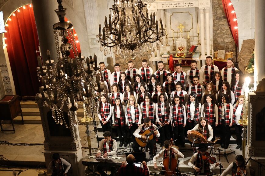 A church choir performs during service in the Greek Orthodox Saint George Cathedral in Damascus