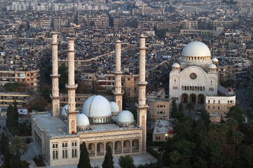 In multi-confessional Aleppo, the Greek Catholic cathedral lies close t the Al-Tawheed mosque and its minarets.