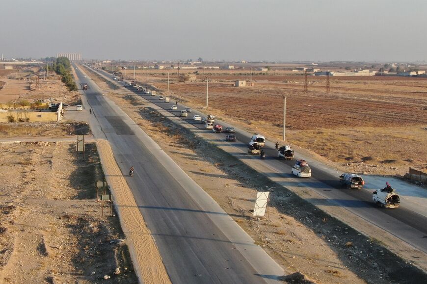 Fleeing Kurdish civilians clog the main highway out of Aleppo to the east.