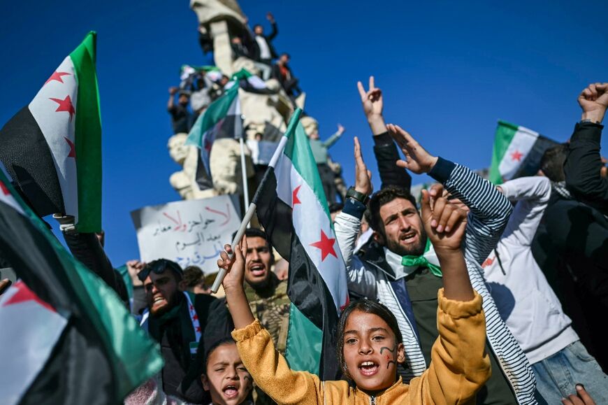 People in Syria's Aleppo celebrate the fall of Assad during rallies called the "Friday of victory"