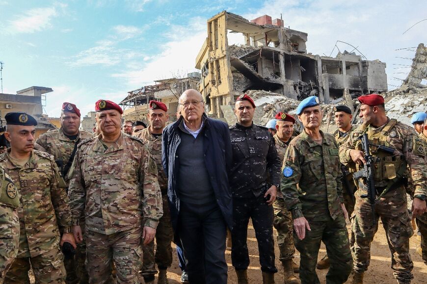 Lebanon's caretaker Prime Minister Najib Mikati (C), Lebanese army commander, General Joseph Aoun (C-L), and Major General Aroldo Lazaro, head of the UNIFIL peacekeepers visited the village of Khiam