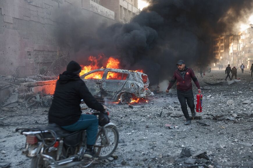 Fires blaze after an air strike on the Syria's jihadist-ruled northwestern city of Idlib.