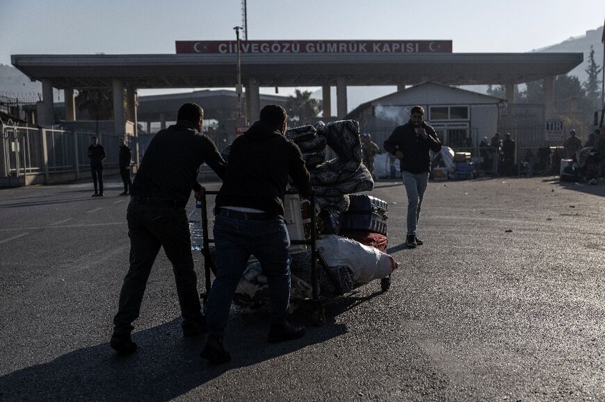 Barely 24 hours after the fall of Assad, several hundred Syrian refugees were waiting at Turkey's Cilvegozu border crossing to return home, many loaded up with baggage