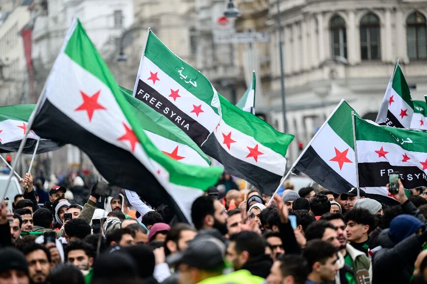 Members of the Syrian community rally in Vienna, Austria to celebrate the end of Assad's rule 