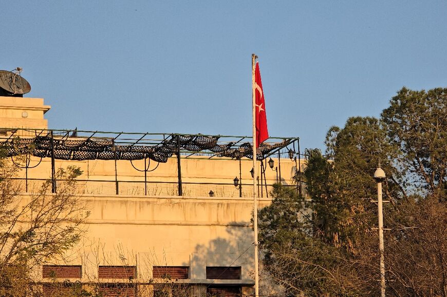 The flag of Turkey hangs from a pole at Ankara's newly-reopened embassy in Damascus