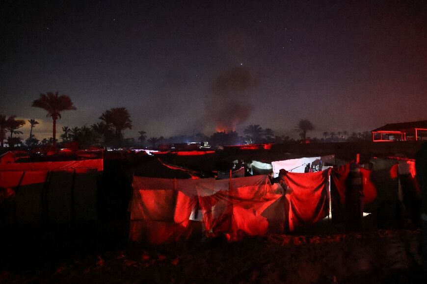 Smoke rises after an Israeli strike near a makeshift camp for displaced Palestinians in Al-Mawasi in the southern Gaza Strip