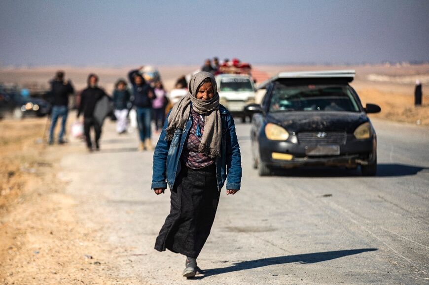 Syrian Kurds fleeing areas north of Aleppo arrive in Tabaqah, on the western outskirts of Raqa