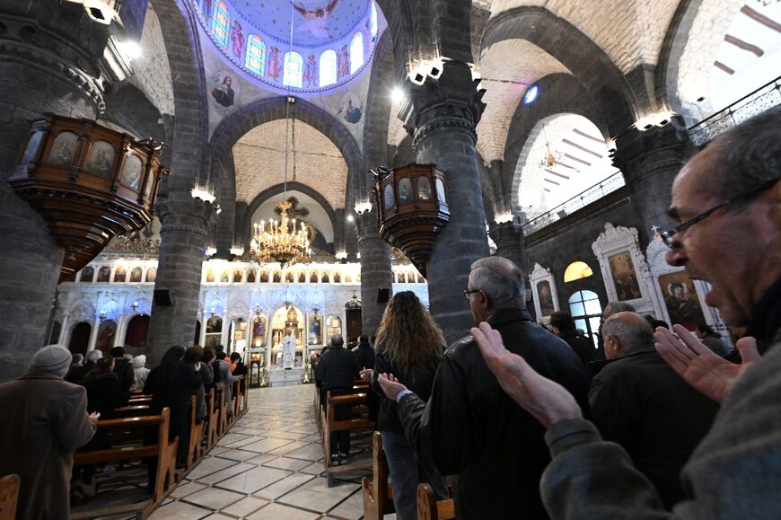 Worshippers attend Sunday Mass at the Cathedral of Our Lady of the Dormition, known also as the Olive Church, in Syria's capital Damascus