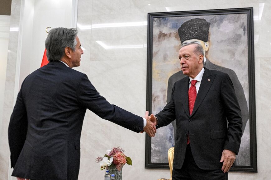 Turkey's President Recep Tayyip Erdogan (R), seen here shaking hands with outgoing US Secretary of State Antony Blinken, has sought to expand his diplomatic reach