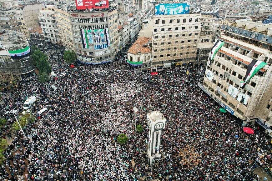 Celebrants crowded together in Homs to rejoice in Assad's fall