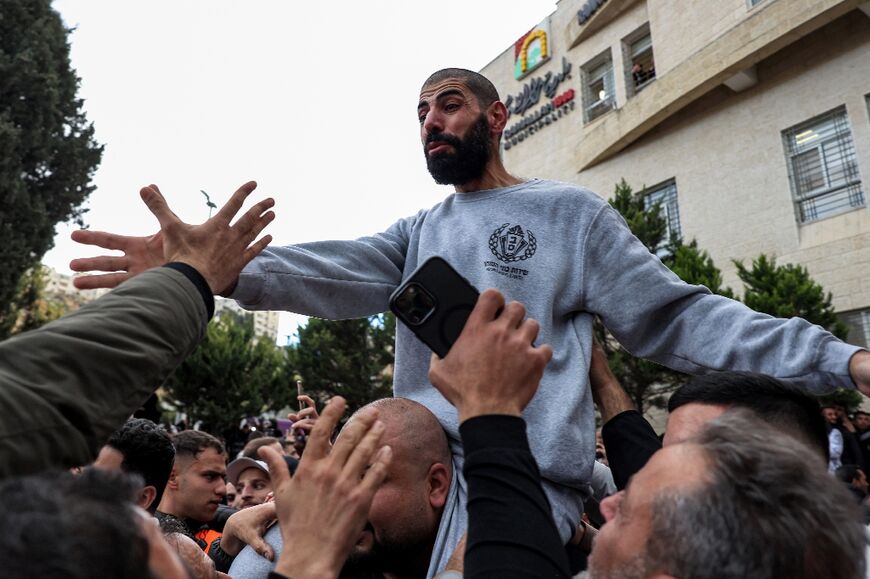 Palestinians carry a release prisoner on their shoulders after his release, in Ramallah in the occupied West Bank