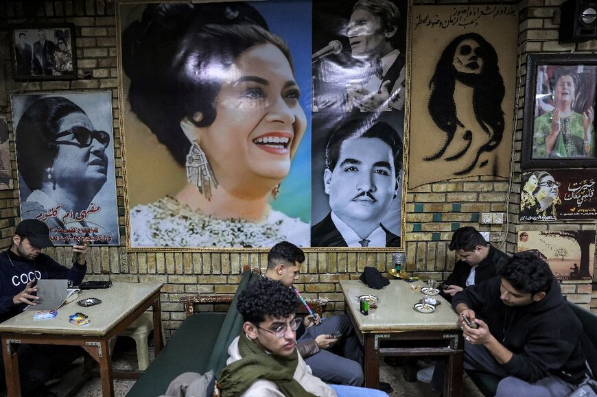 People sit at a cafe in Baghdad named after Umm Kulthum